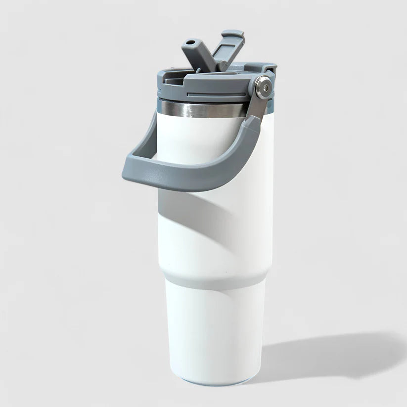 "White stainless steel insulated tumbler with leakproof flip-top lid on white background – hot and cold travel mug"